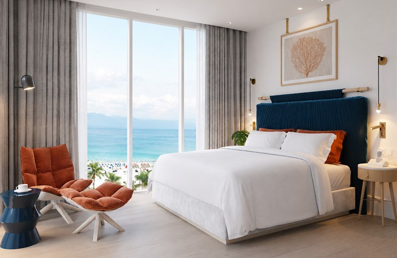 Phòng khách sạn hướng biển với rèm vải dày và voan